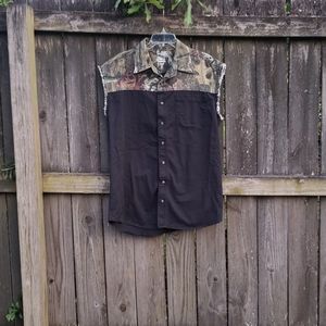 Black and camouflage sleeveless button up shirt.